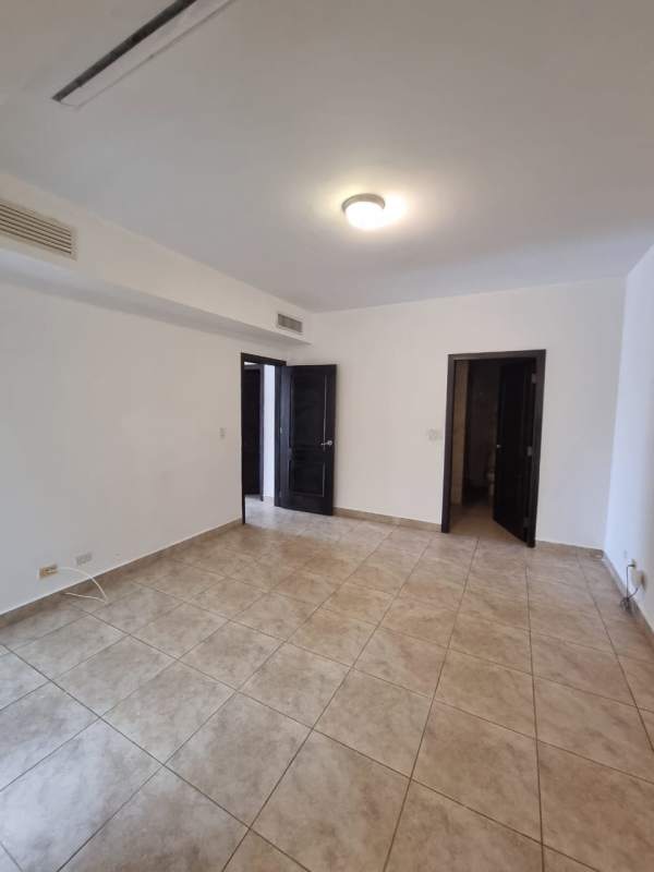 Empty living room with porcelain tile floor, neutral colors in Tucan Country Club Panama