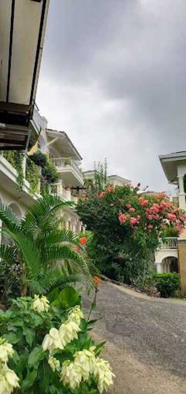 Bright bedroom with built-in wardrobe, tiled floors, and AC ready at Tucan Country Club