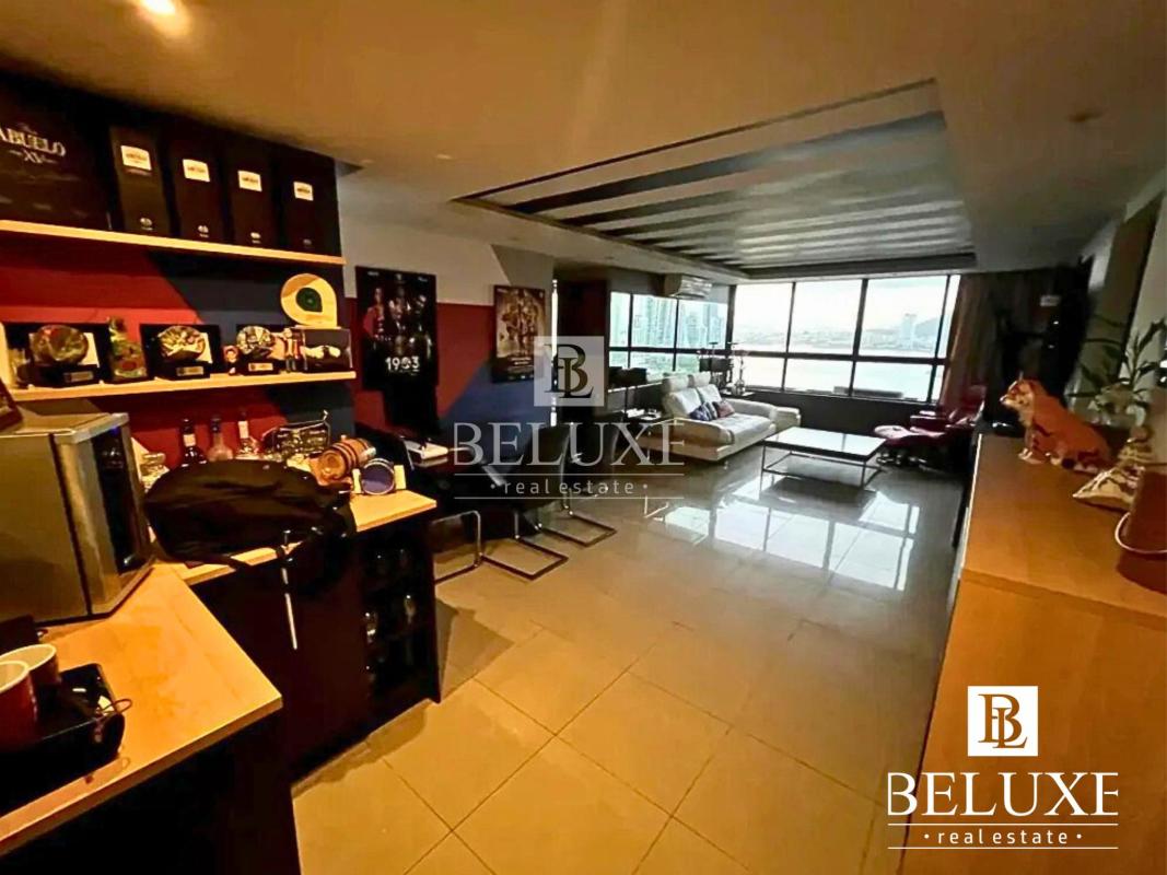 Master bedroom with ocean view window in furnished apartment PH Bahia Balboa Paitilla Panama