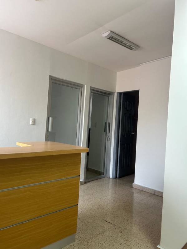 Reception lobby with tile floor and wood desk in Office House Coco del Mar Panama