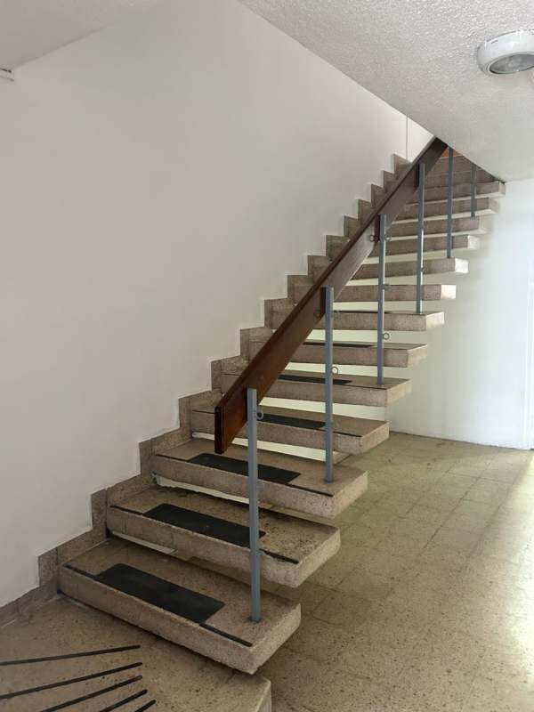 Floating staircase connecting floors inside commercial house for rent Panama City