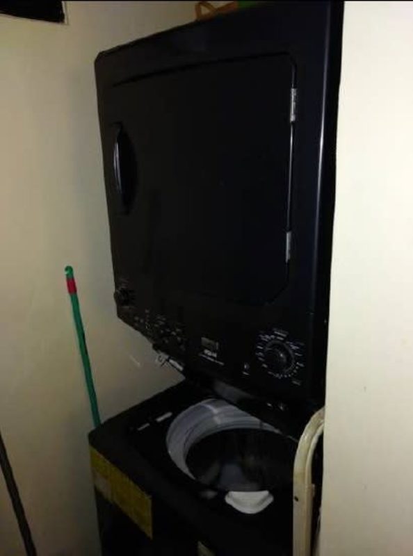 Compact laundry space with stacked washer dryer PH Villa Andalucía Don Bosco Panama