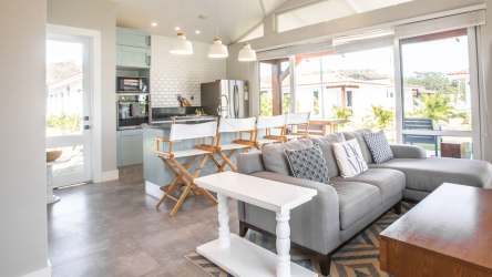 Open plan kitchen with island dining bright windows Playa Venao luxury villa