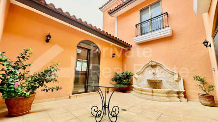 Covered patio overlooking swimming pool and garden at Buenaventura luxury villa Panama