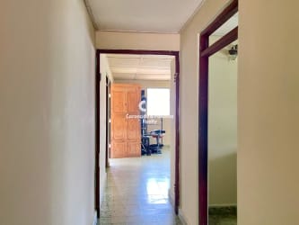 Hallway with tiled floor inside commercial property for sale in Santiago Veraguas Panama