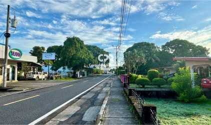 Street level view with businesses and residential along commercial route in Santiago Panama