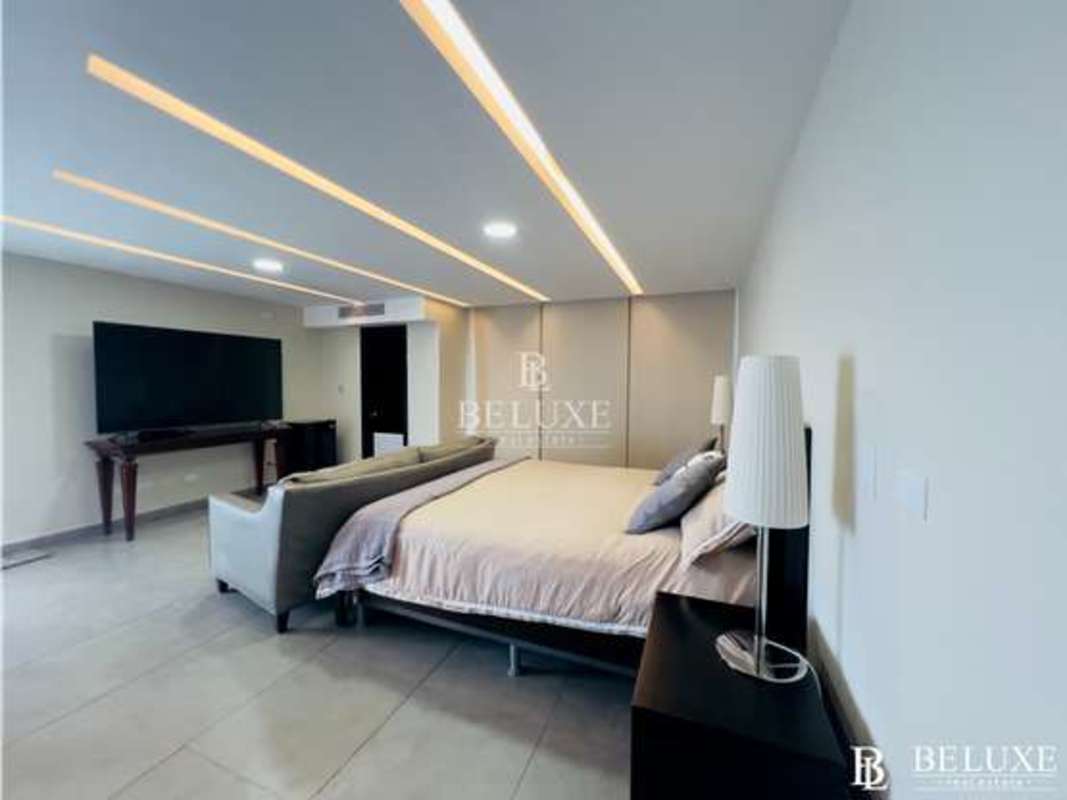 Modern living room with marble floors, floating staircase and premium finishes at PH Bahia del Golf Coco del Mar Panama