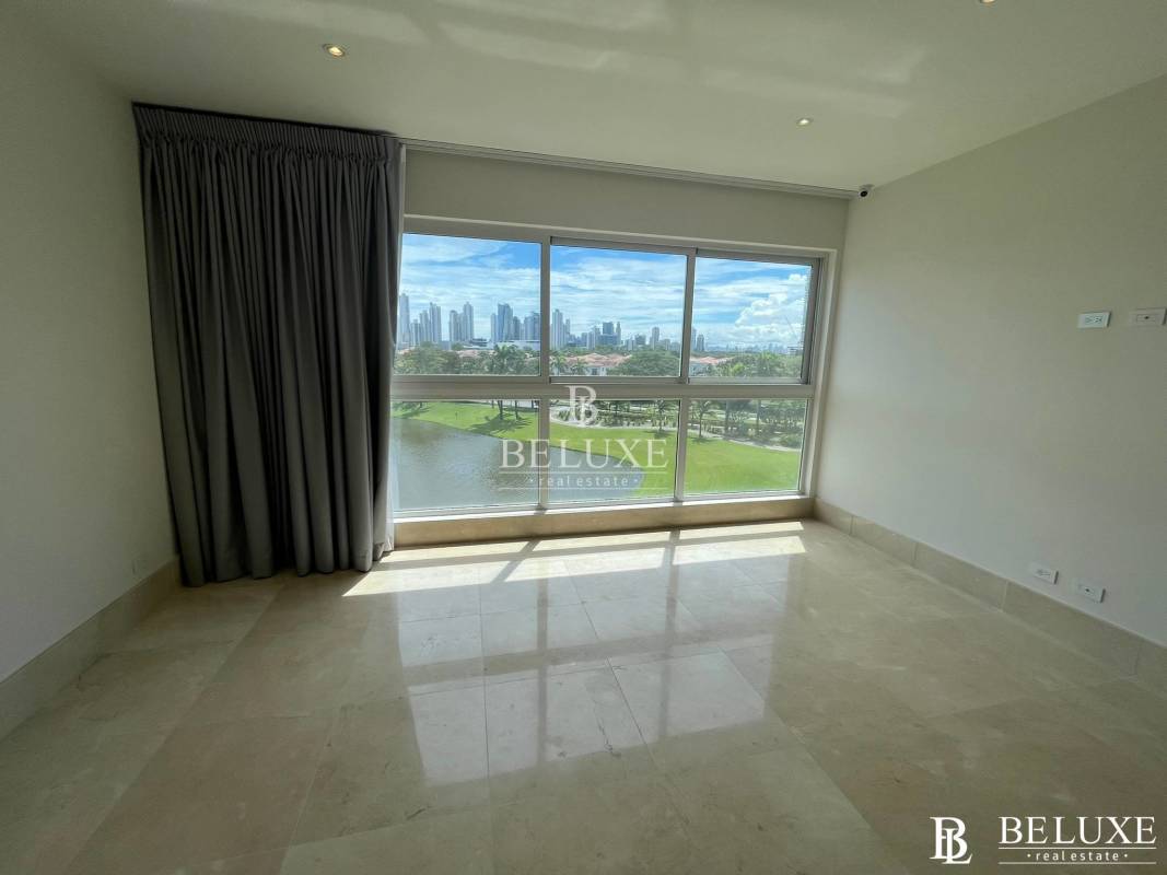 Large bedroom with windows and walk-in closet in The Reserve Panama apartment