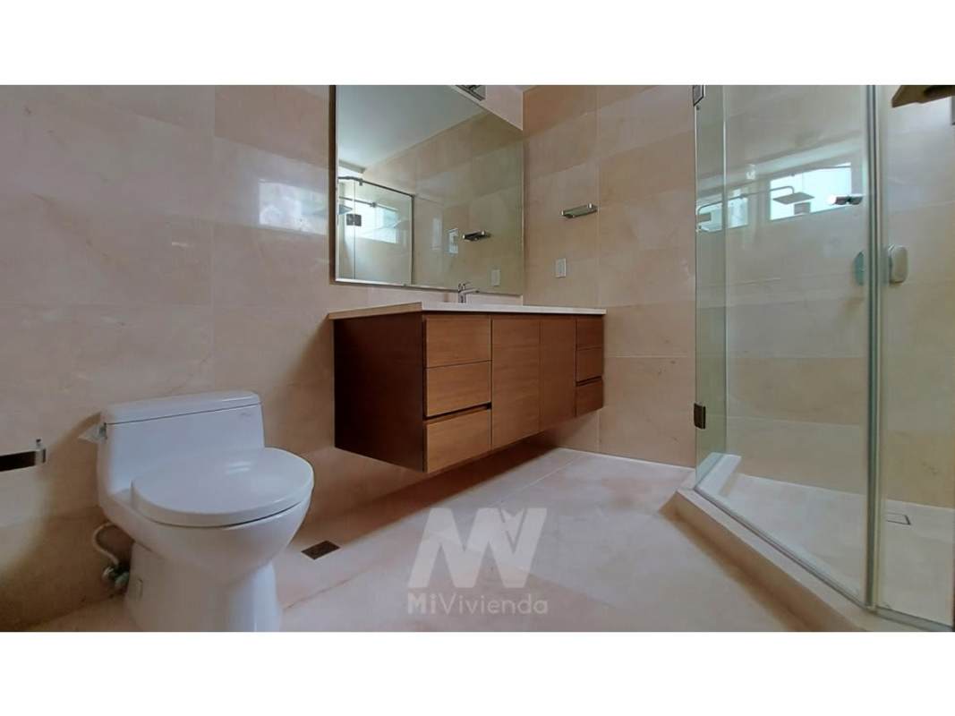 Modern bathroom with marble countertop, glass shower enclosure luxury apartment Green Garden Santa Maria