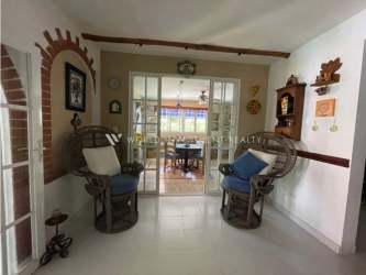 Mediterranean style covered patio and lush garden at Coronado Golf luxury villa Panama