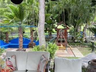 Covered veranda with garden views at Coronado Golf luxurious villa in Panama