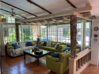 Bright Mediterranean style living room with large windows at Coronado Golf Panama