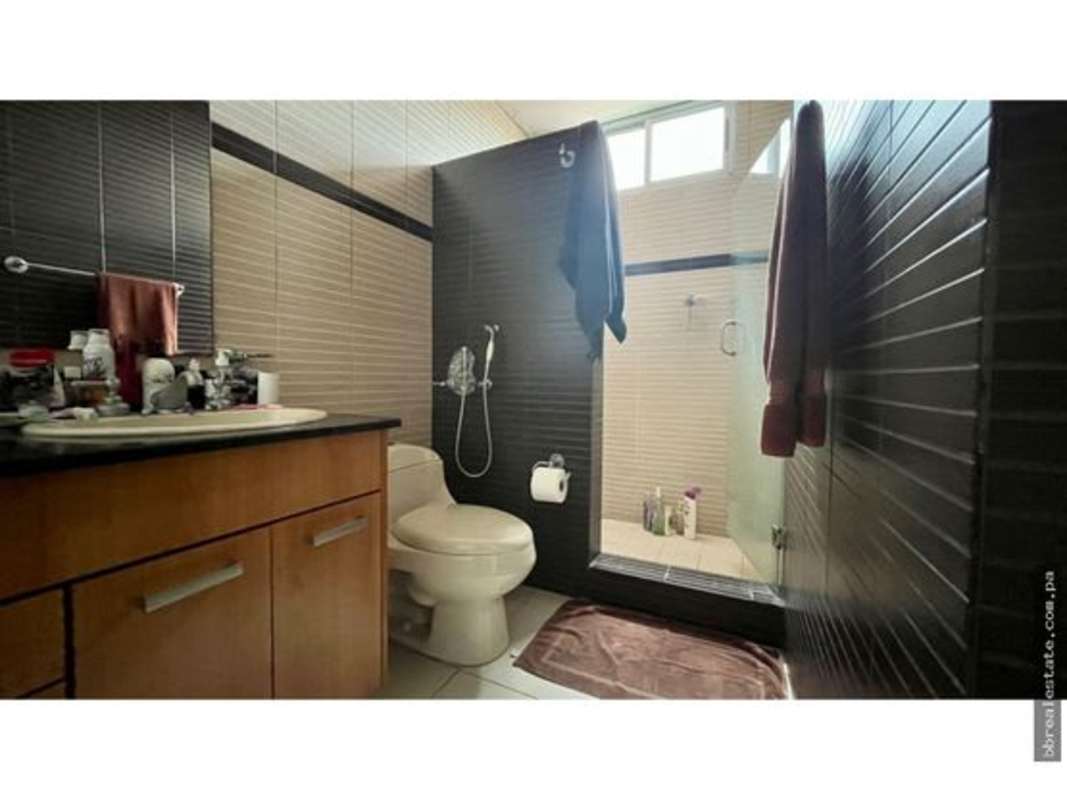 Bathroom with glass walk-in shower and elegant tiles in PH Soho Tower Costa del Este Panama