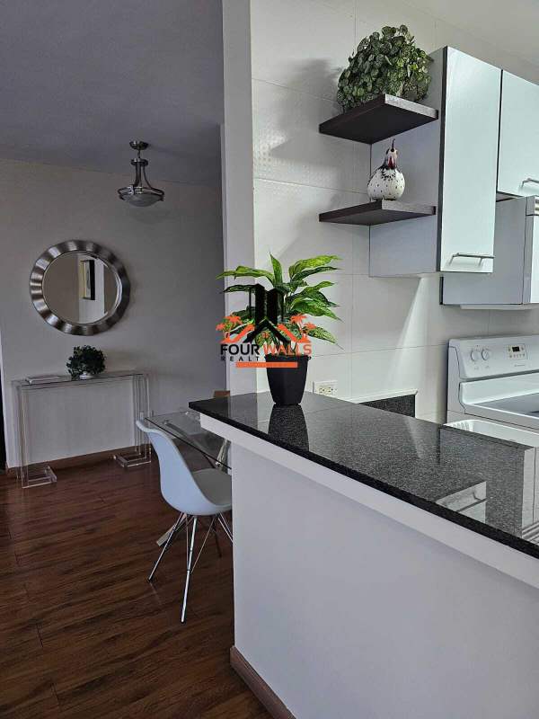 Bright living room with floor-to-ceiling windows, ocean view balcony at PH BICSA Panama City