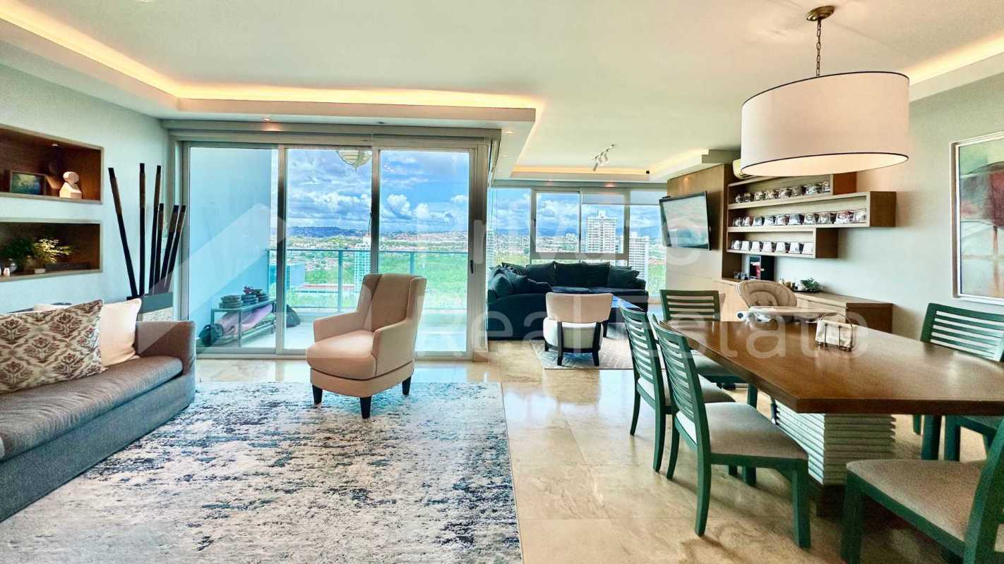 Modern bathroom with marble counters, double sinks, glass shower enclosure in PH Titanium Panama