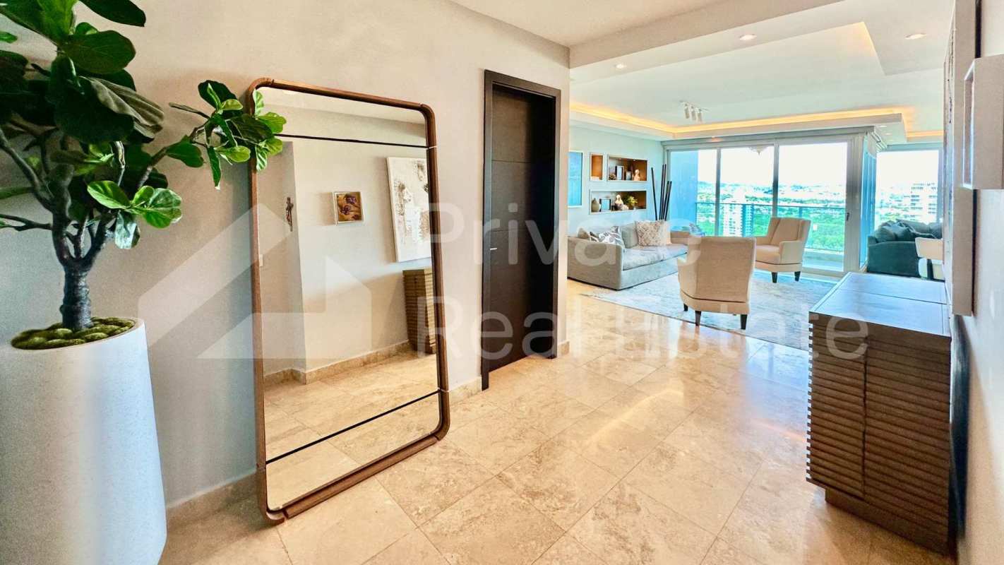 Remodeled kitchen with granite counters, white cabinets, and appliances in PH Titanium