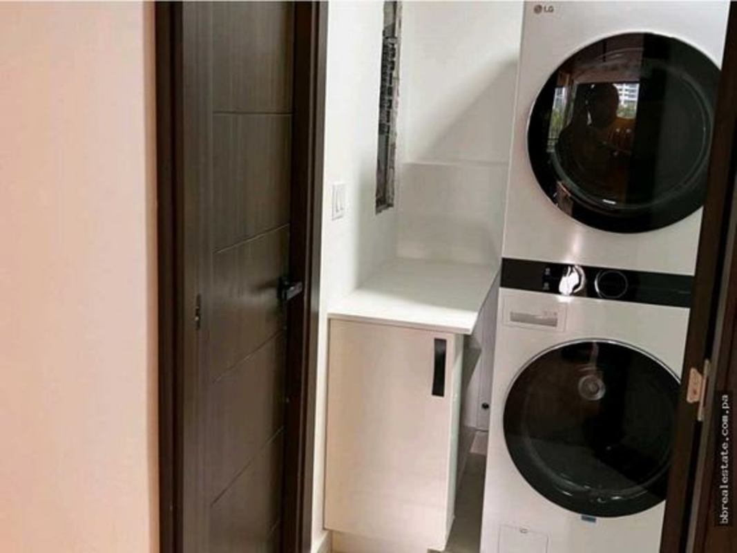 Laundry room equipped for washer dryer with storage cabinets PH Country Park San Francisco Panama City