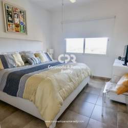 Bright spacious living dining room with balcony access golf views PH El Alcazar Coronado Panama