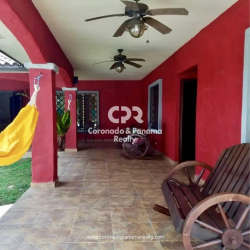 Rustic covered patio with hammock and wood furniture house for sale Coronado golf estate