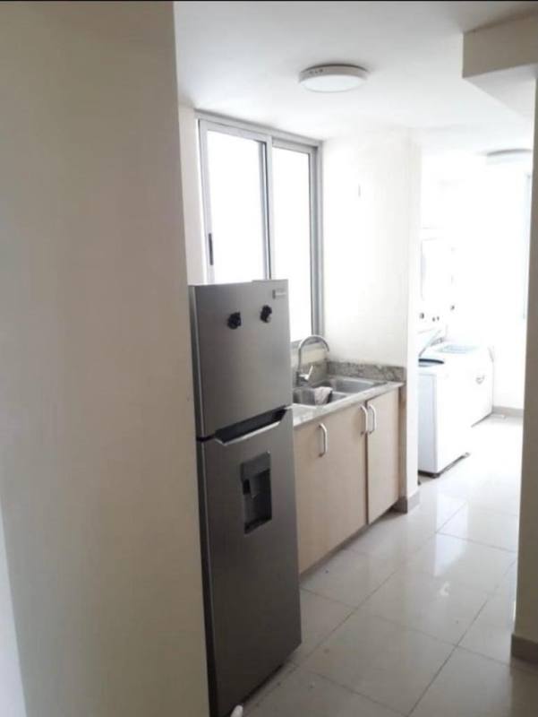 Laundry area with window and tile floor in PH Rokas Condado del Rey Panama