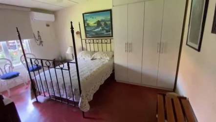 Shaded poolside terrace with ceiling fans and garden view in Coronado Panama