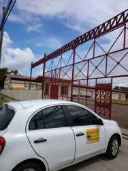 Fenced exterior yard space with security gate and open area suitable for truck maneuvering at warehouse park David Panama