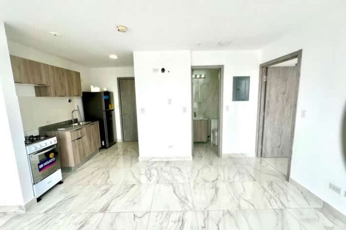Modern kitchen dining area with large window overlooking Panama City at The Gray Tower