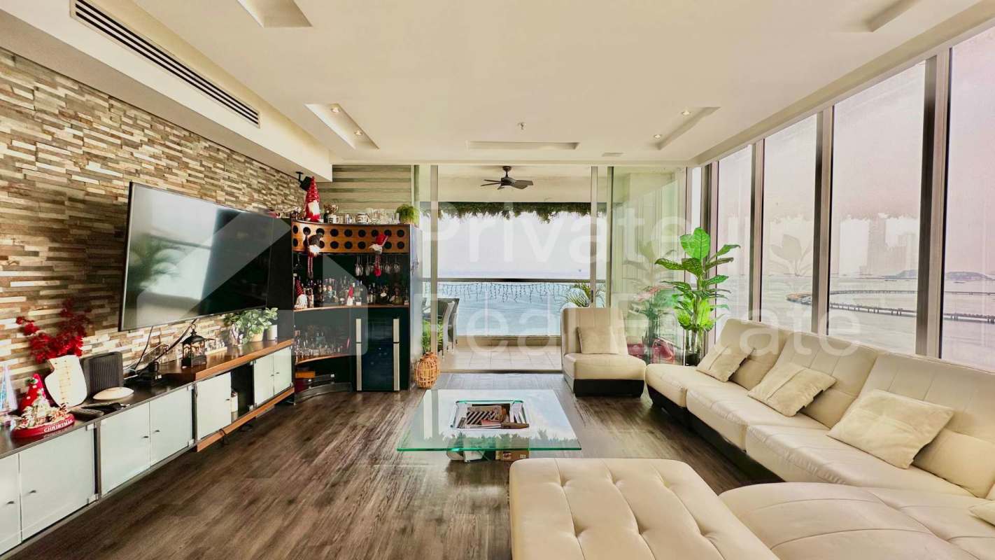 Modern open-concept kitchen with island, appliances, water views at PH Rivage Panama