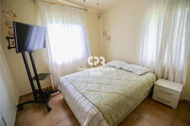 Spacious bedroom with ensuite bathroom and garden view at Tortuga Lake Coronado Panama