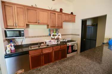 Traditional kitchen with wooden cabinets granite countertops in Coronado Tortuga Lake Panama
