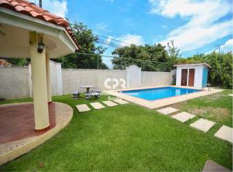 Private backyard swimming pool fenced garden in Coronado Golf beach community Panama