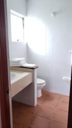 Villa porch terrace with views of pool, lake, and golf course at Mantarraya Golf Panama