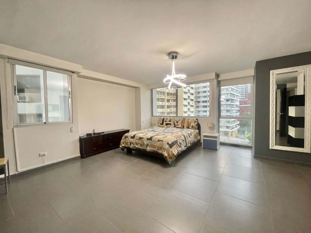 Master bedroom furnished with AC and large window city view in Punta Paitilla PH La Joya Panama