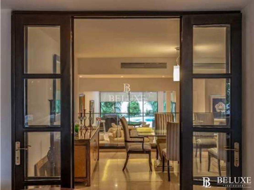 Outdoor jacuzzi terrace overlooking private pool tropical gardens Obarrio duplex house Panama