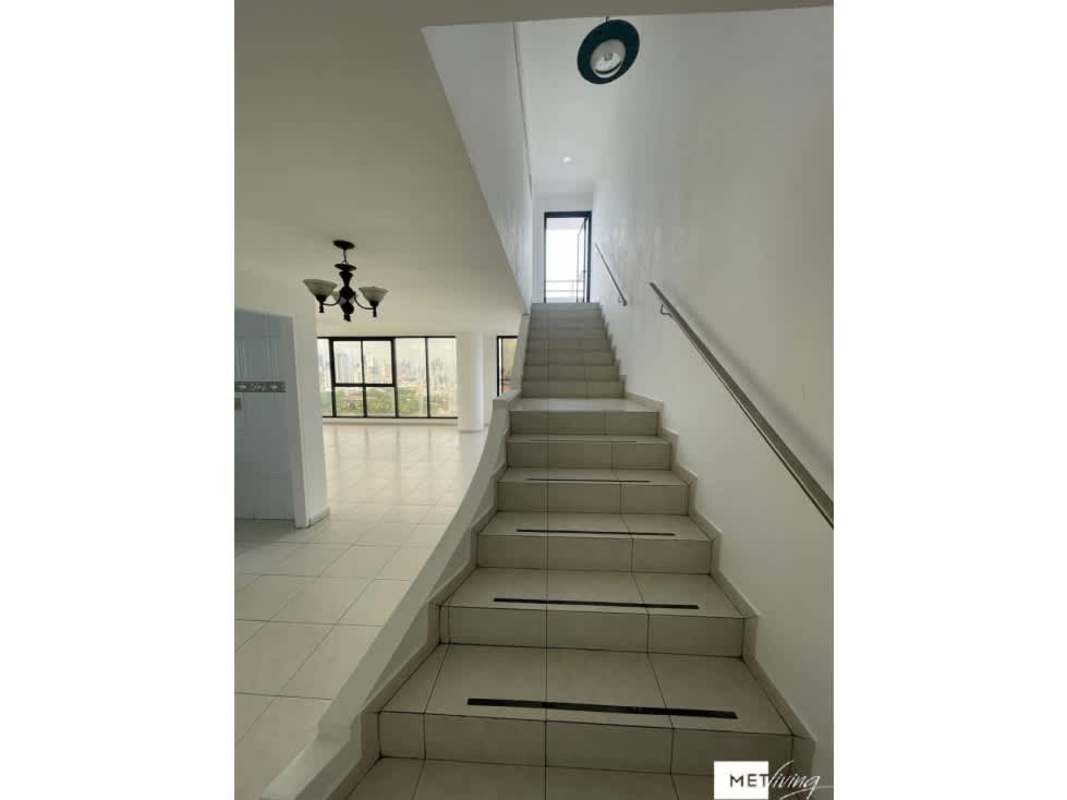 Interior staircase flooded with light connecting two penthouse levels PH La Loma