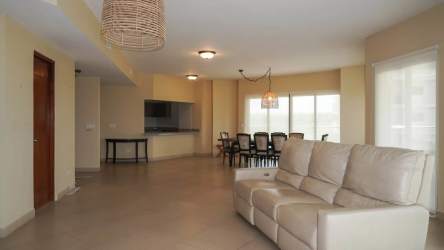 Gourmet kitchen with granite counters, island, stainless appliances in Vista Mar condo Panama