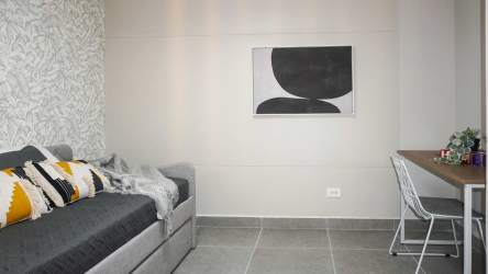 Modern living room opening to ocean view balcony at The Palms at El Palmar Panama