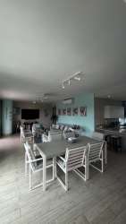 Spacious master bedroom with large bed, closet, balcony access in PH Solea Punta Barco Panama