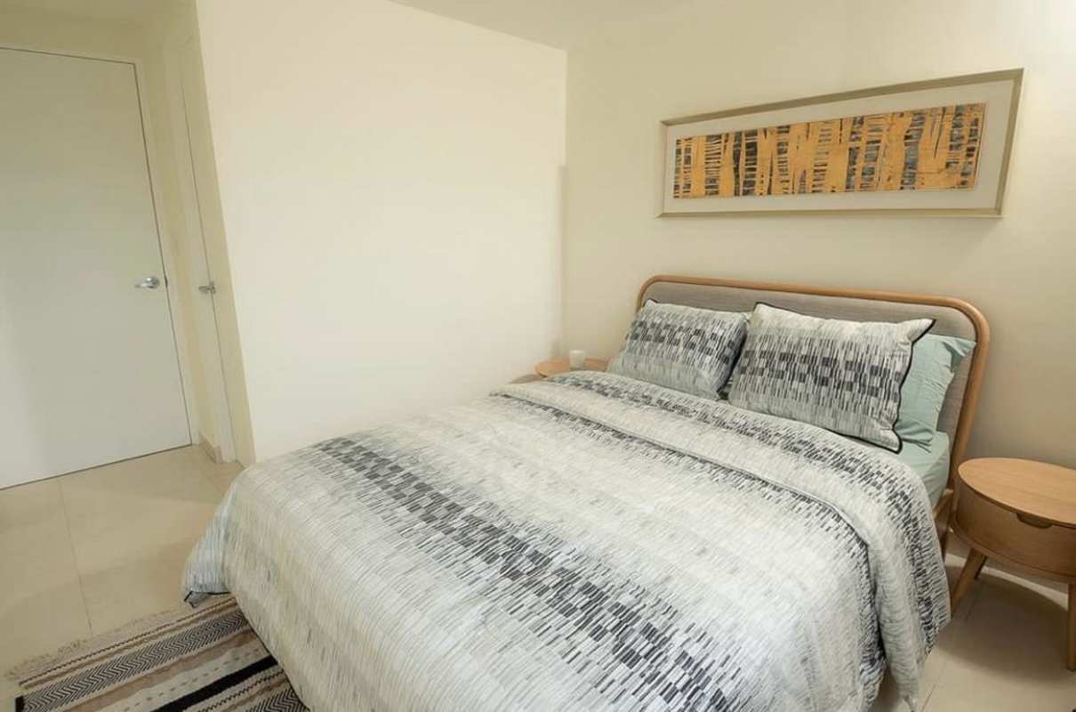 Modern kitchen with granite countertop, white cabinets in Panama Viejo apartment Panama City