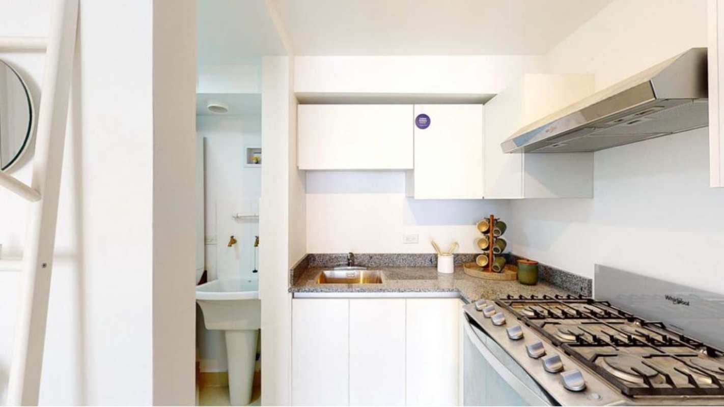 Contemporary apartment complex facade at Panama Viejo Residences with balconies.