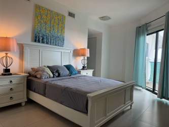 Modern open kitchen with granite countertops and stainless appliances in Vista Mar condo Panama