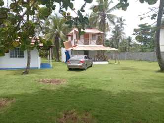 Two-story guest house with parking space lush gardens near Caribbean beach Palenque Panama