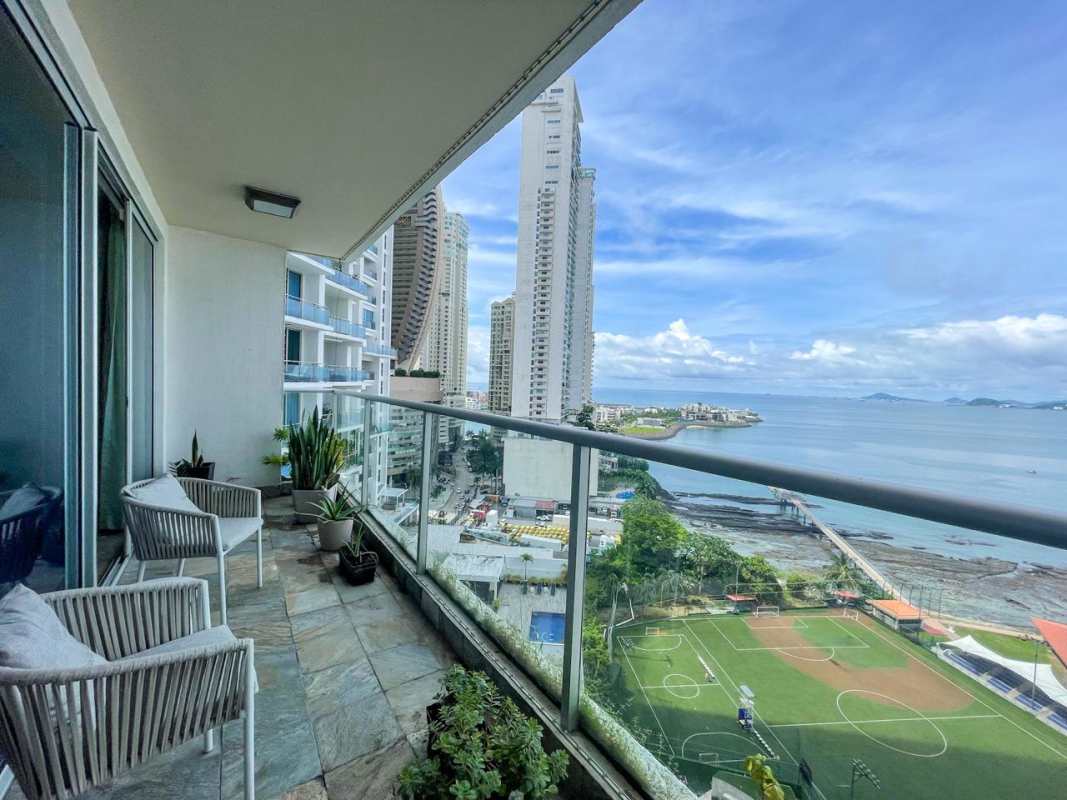 Spacious living area with marble floors floor-to-ceiling windows ocean views PH Q Tower
