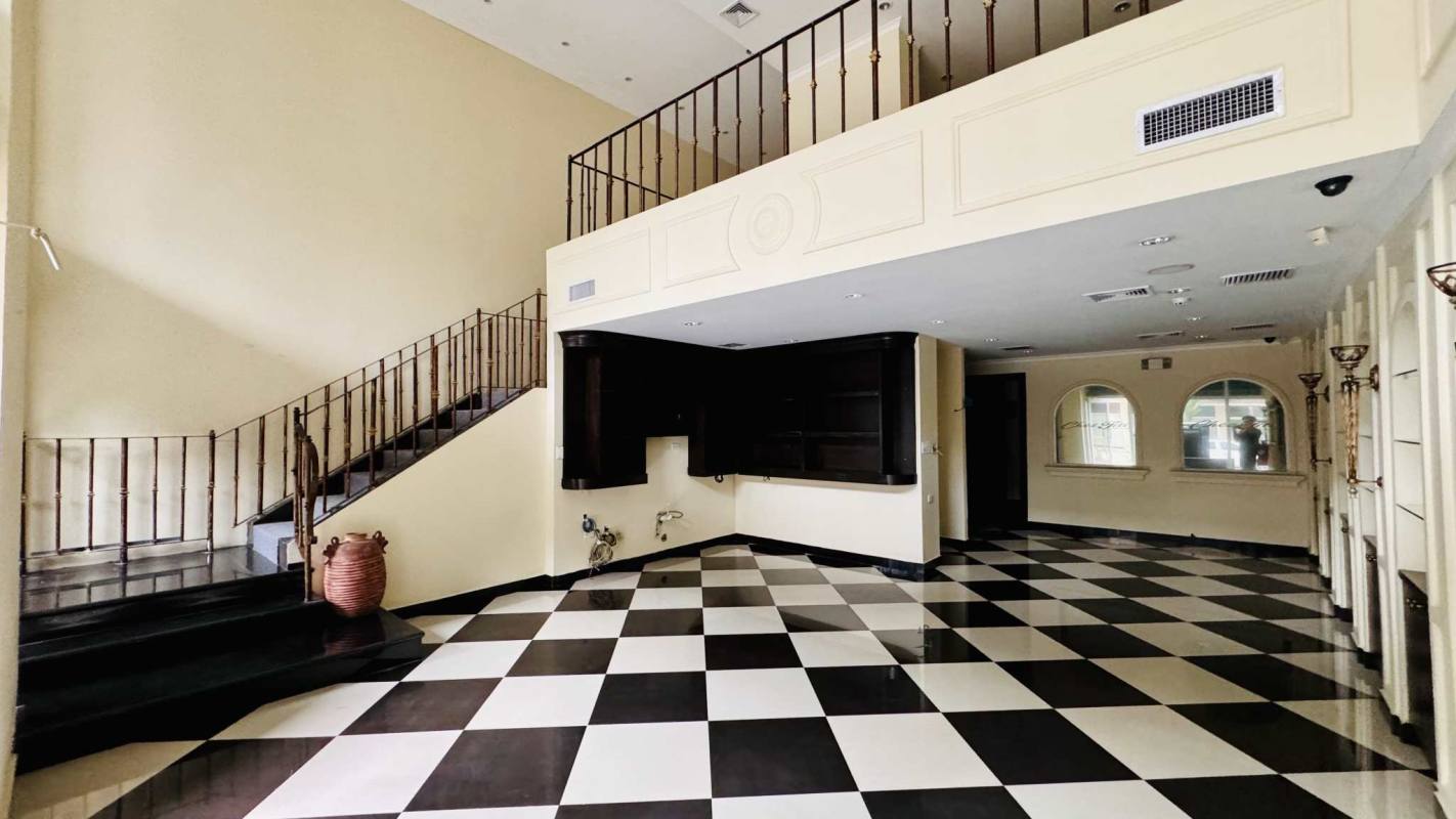 Reception lobby area with built-in wood counter and decorative finishes in El Cangrejo Panama