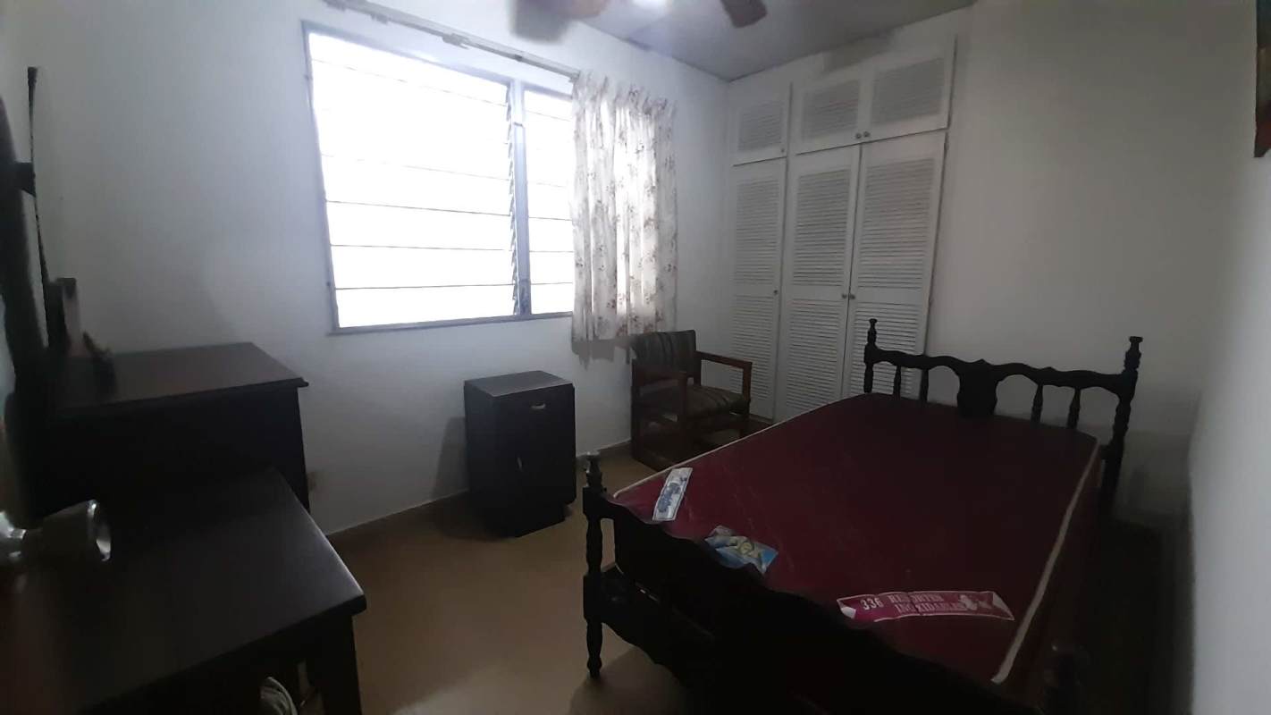 Bedroom with large closet, ceiling fan, natural light Panama home for sale