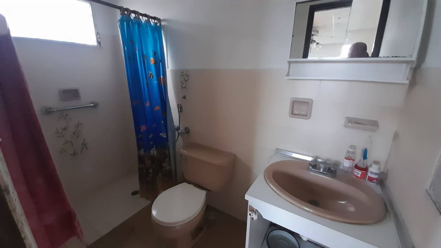 Functional bathroom with grab bars and shower area Altos del Chase house