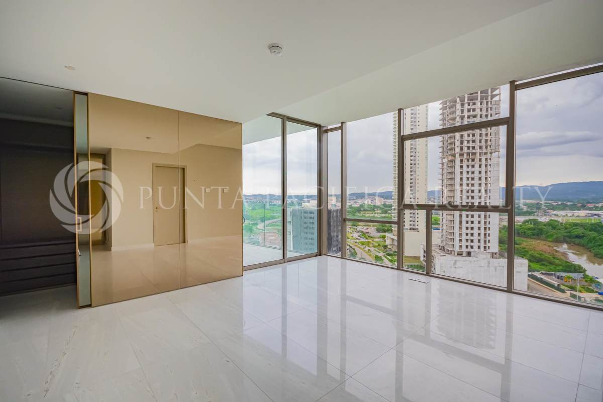 Living room with full-height windows and marble floors overlooking city view in Santa Maria Panama