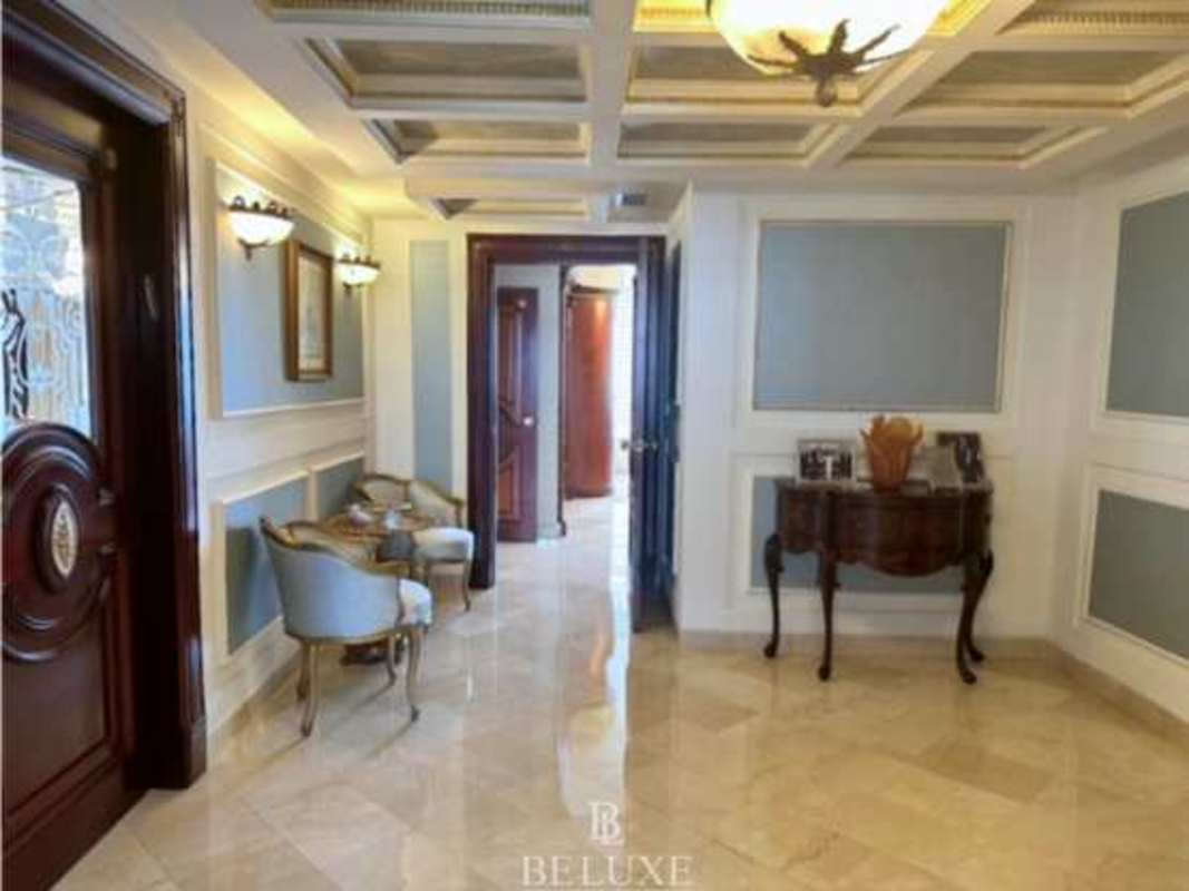 Luxury dining area with panoramic windows and skyline view PH Bayside Paitilla Panama