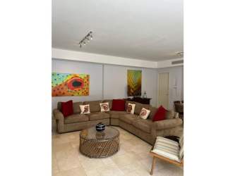 Hallway with floor-to-ceiling windows and natural light at Punta Arena Buenaventura Panama condo