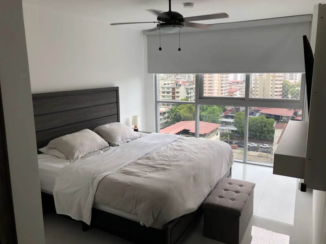 Modern bathroom with walk-in shower, glass partition and tile at PH Argentina Panama City
